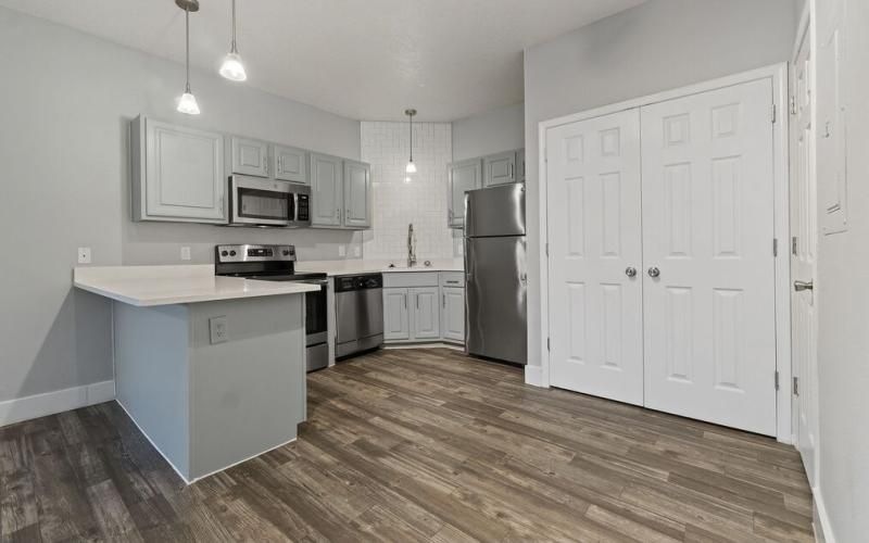 a kitchen with white cabinets