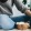 a woman sitting beside a bowl of popcorn